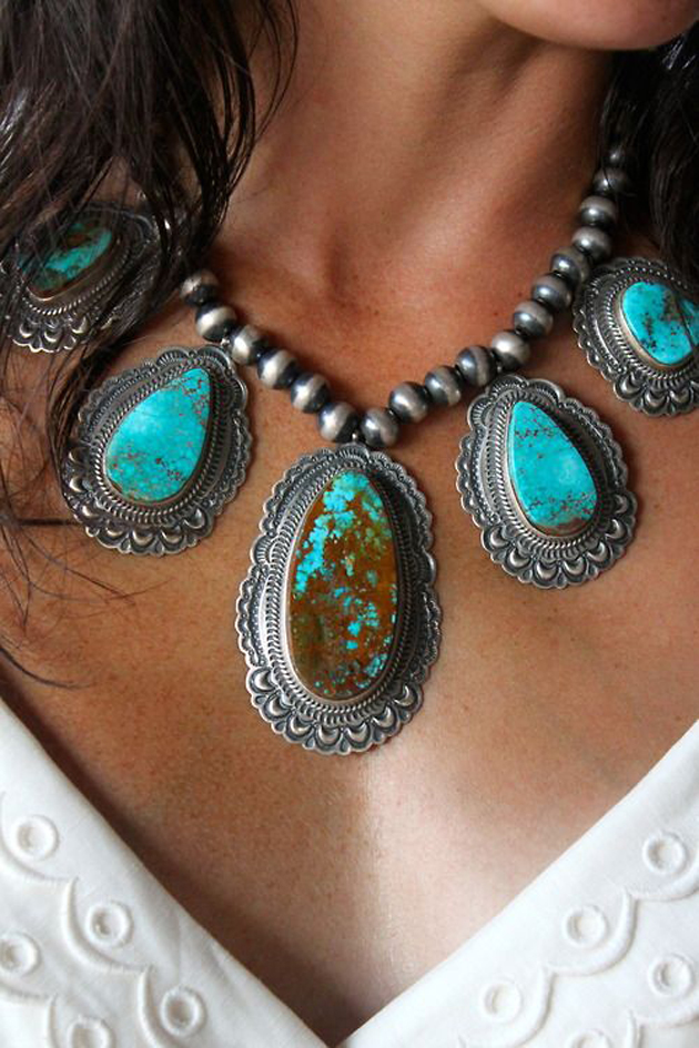 woman's neck with a boho turquoise necklace