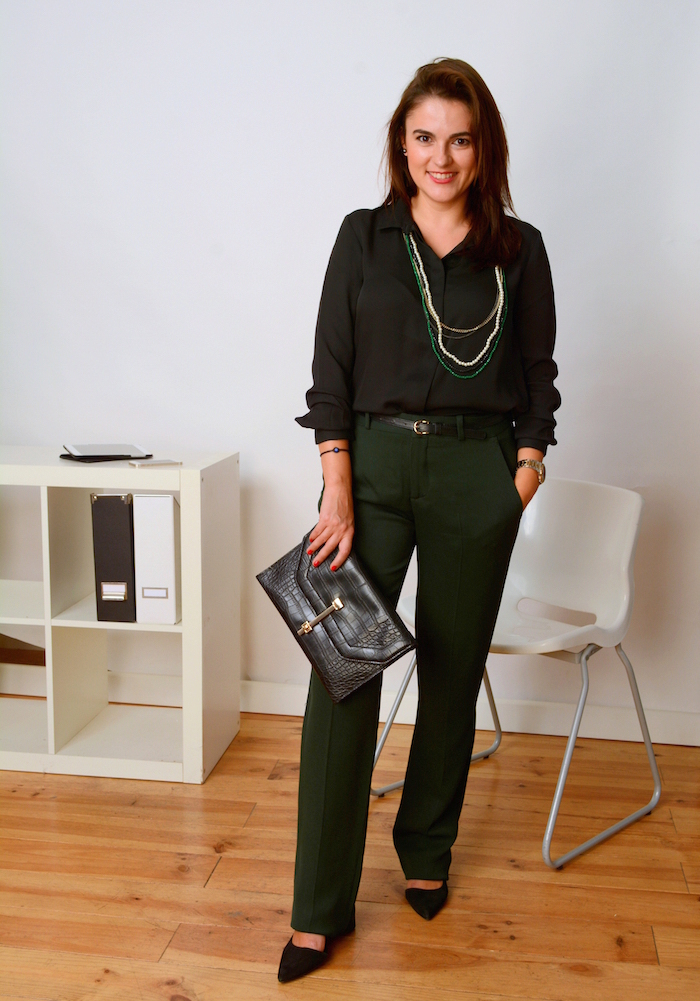 office style in slacks and black shirt